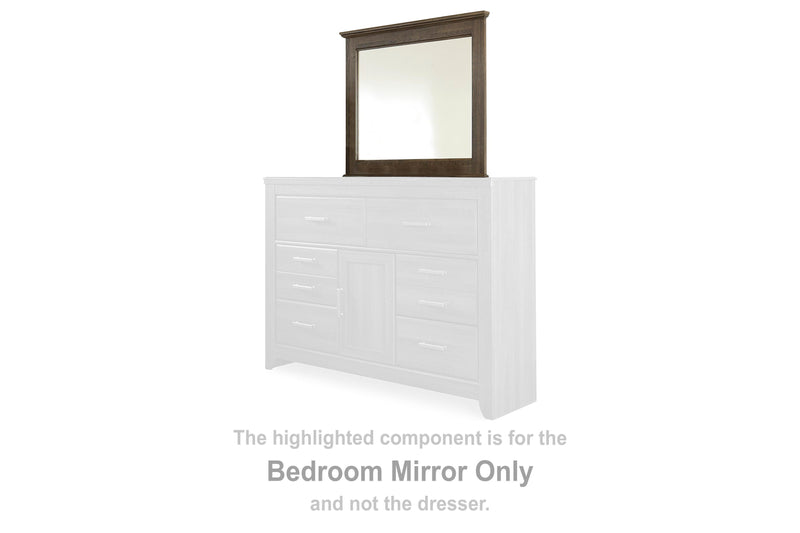 Ashley Furniture Juararo bedroom mirror with a sleek rectangular design and a wooden frame in a warm finish.