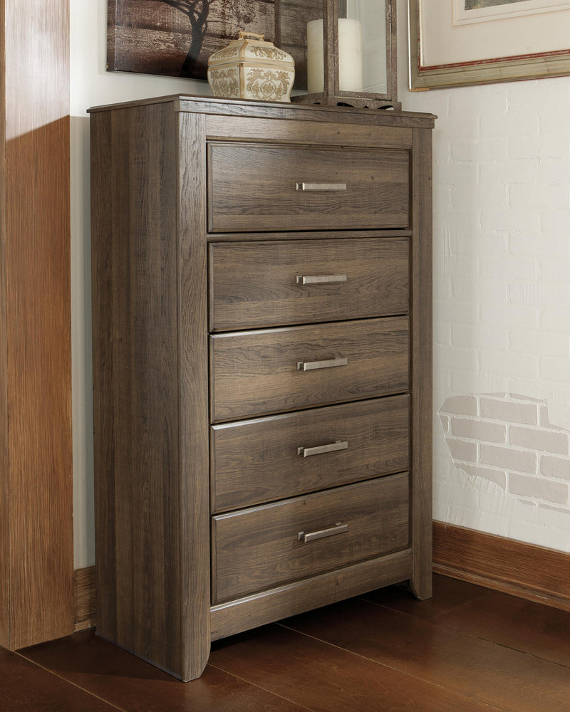 Ashley Furniture Juararo chest of drawers with six spacious drawers and a warm wood finish for stylish storage.