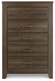 Ashley Furniture Juararo chest of drawers with a dark wood finish and sleek metal handles, shown from a front head-on view.