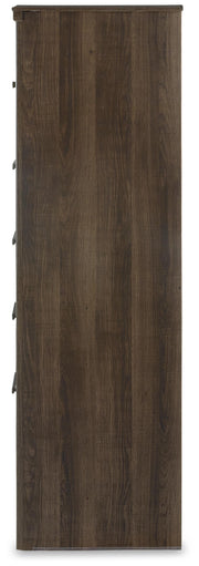 Ashley Furniture Juararo chest of drawers with dark wood finish and sleek metal handles, shown from a side view.
