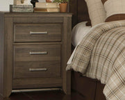 Ashley Furniture Juararo nightstand with dark wood finish, featuring drawer and shelf storage.