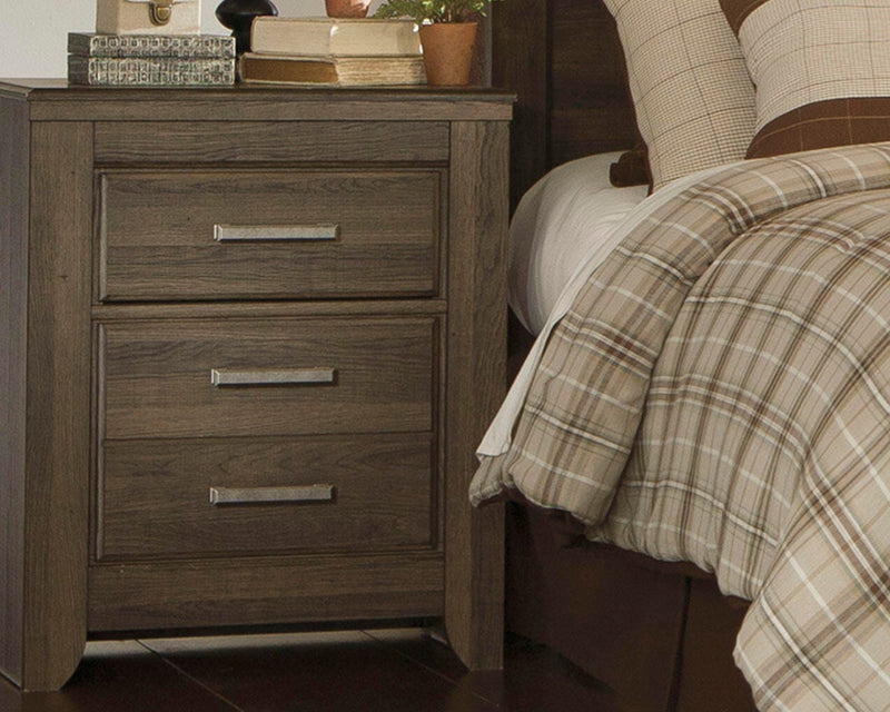 Ashley Furniture Juararo nightstand with dark wood finish, featuring drawer and shelf storage.