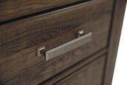 Ashley Furniture Juararo nightstand with a sleek wood finish, detailed drawer handles, and modern design for bedroom decor.