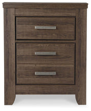 Ashley Furniture Juararo nightstand with a sleek dark finish and modern design, featuring a single drawer and open shelf.
