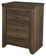 Ashley Furniture Juararo bedroom set featuring a bed, dresser, and nightstands with a modern wood finish and stylish hardware.