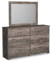 Ashley Furniture Ralinksi bedroom set with a bed, nightstands, and dresser in a modern bedroom scene.