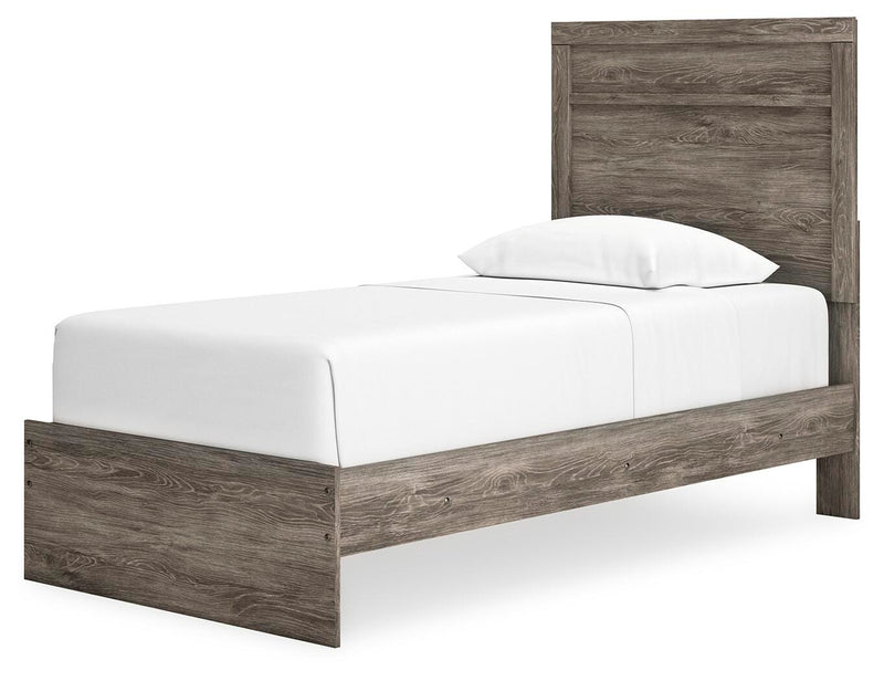 Ashley Furniture Ralinksi bedroom set with a modern bed frame, matching nightstands, and bedroom decor in a cozy, stylish bedroom scene.