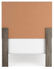 Ashley Furniture Ralinksi bedroom set with a bed, nightstands, and dresser in a modern design, shown from the back view.