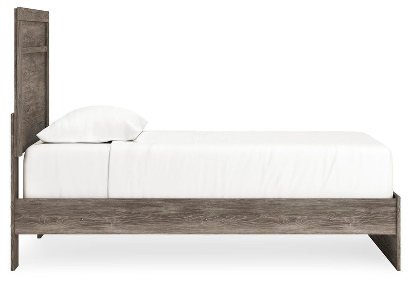 Ashley Furniture Ralinksi bedroom set with a bed, nightstands, and dresser, featuring modern design and wood finish.
