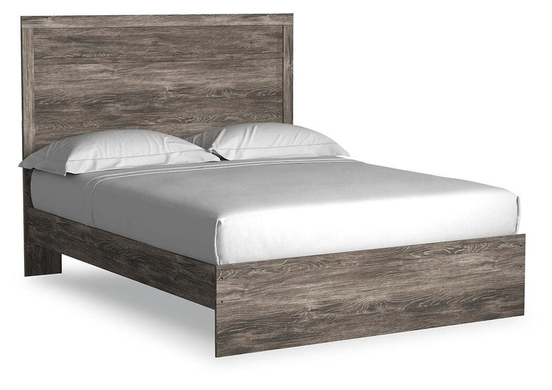 Ashley Furniture Ralinksi bedroom set shown from an angle, featuring a modern bed frame, matching nightstands, and stylish bedroom decor.