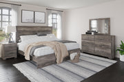 Ashley Furniture Ralinksi bedroom set with a bed, nightstands, and dresser in a modern bedroom scene