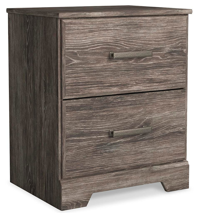 Ashley Furniture Ralinksi bedroom set shown from a side angle, including a bed frame, nightstands, and dresser in a modern bedroom setting.