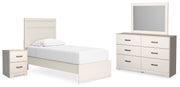 Ashley Furniture Stelsie bedroom set with a bed frame, matching nightstands, and dresser in a stylish bedroom scene.