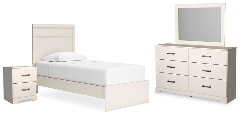 Ashley Furniture Stelsie bedroom set with a bed frame, matching nightstands, and dresser in a stylish bedroom scene.
