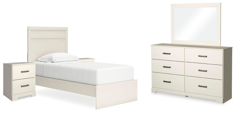 Ashley Furniture Stelsie bedroom set featuring a bed, nightstands, and matching dresser in a stylish, modern bedroom design.