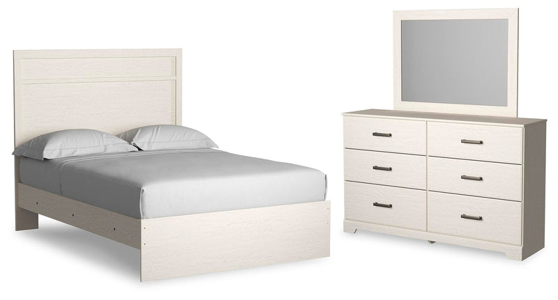 Ashley Furniture Stelsie bedroom set featuring a bed, nightstands, and dresser in a modern design, shown in the image.