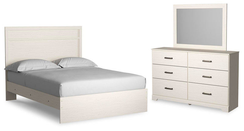 Ashley Furniture Stelsie bedroom set with a bed, nightstands, and dresser in a modern bedroom layout.