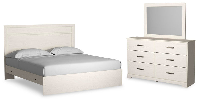 Ashley Furniture Stelsie bedroom set displayed in a cozy bedroom with a bed, nightstands, and matching dressers
