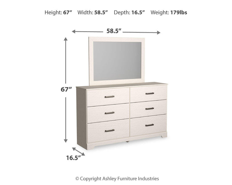 Ashley Furniture Stelsie bedroom set with a bed, nightstands, and dresser in a modern, elegant bedroom layout.