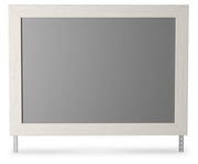 Ashley Furniture Stelsie bedroom mirror, rectangular mirror with a sleek frame, designed for stylish bedroom decor.