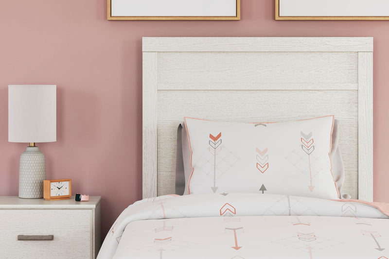 Ashley Furniture Stelsie Bedroom Set with a modern bed frame and matching nightstands, shown in a stylish bedroom setting.