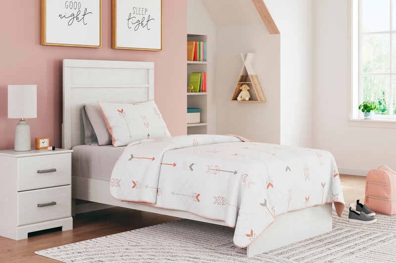 Ashley Furniture Stelsie Bed with a sturdy wooden frame and elegant design, shown in a cozy bedroom setting.