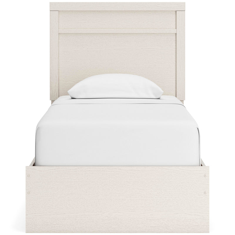 Ashley Furniture Stelsie bedroom set featuring a bed with a padded headboard and matching nightstands in a modern bedroom scene.
