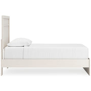 Ashley Furniture Stelsie Bed with a stylish design, shown from the side view in a modern bedroom setting.