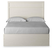 Ashley Furniture Stelsie Bed with a stylish headboard, showcasing a cozy and elegant design for a modern bedroom.