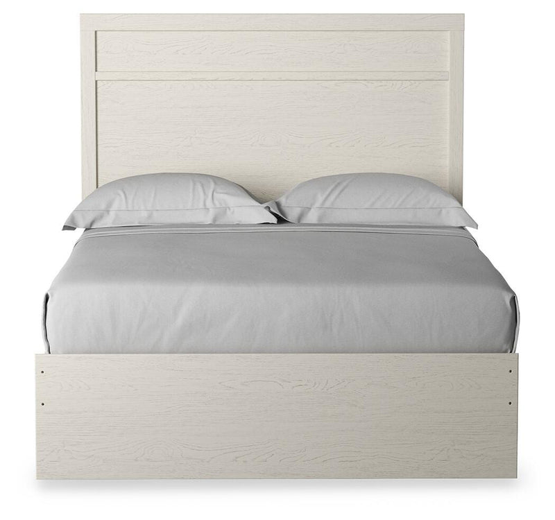 Ashley Furniture Stelsie Bed with a stylish headboard, showcasing a cozy and elegant design for a modern bedroom.