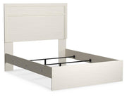 Ashley Furniture Stelsie Bed with a stylish wooden frame and modern design, shown from an angled view.