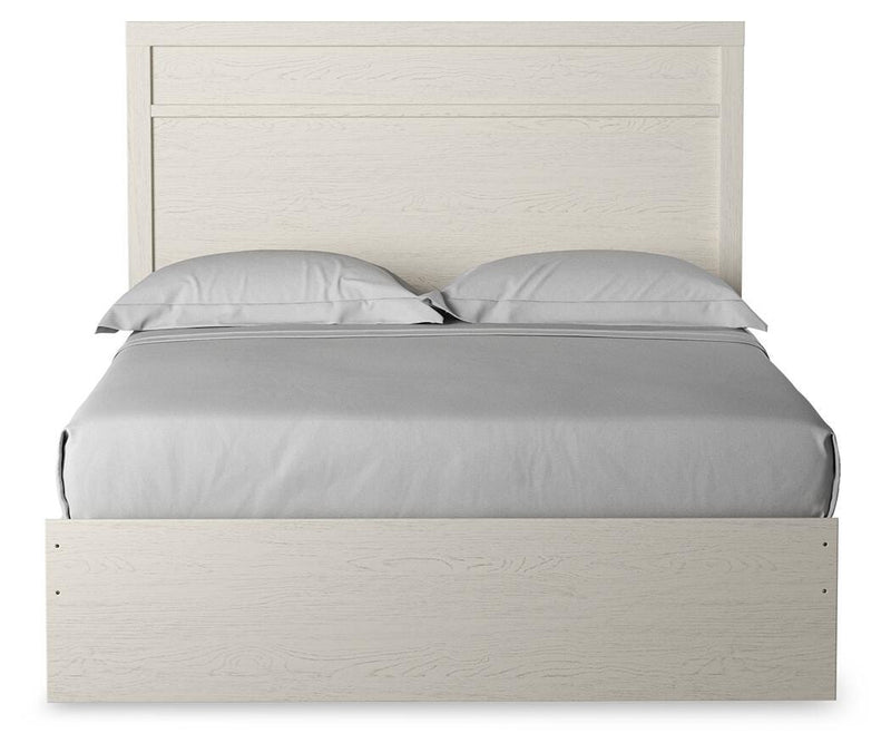 Ashley Furniture Stelsie Bed with a sleek headboard in a modern bedroom setting.