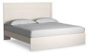 Ashley Furniture Stelsie Bed with a stylish frame, shown from a side angle in a well-lit bedroom setting