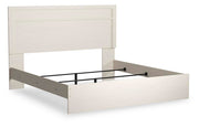Ashley Furniture Stelsie Bed with a sleek wooden frame and modern design, shown from an angled view.