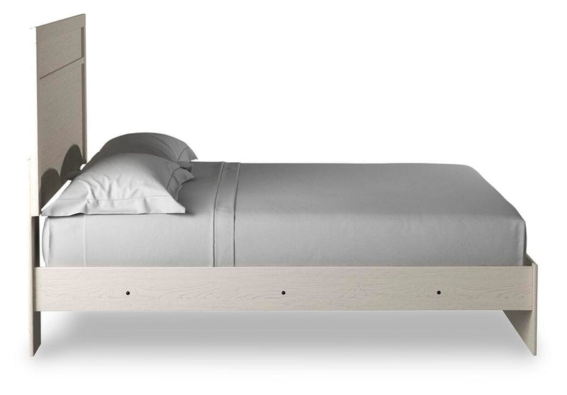 Ashley Furniture Stelsie Bed with side panels, showcasing a modern bedroom design in natural wood finish.