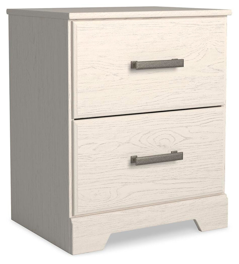 Ashley Furniture Stelsie bedroom set shown from an angled view, including bed frame, nightstands, and matching bedroom furniture.
