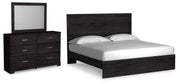 Ashley Furniture Belachime bedroom set with a bed, nightstands, and dresser in a modern bedroom scene.