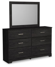 Ashley Furniture Belachime bedroom set with a bed, nightstands, and dresser, shown in a stylish, modern bedroom scene.