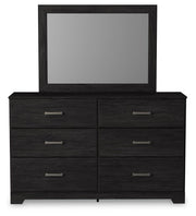 Ashley Furniture Belachime bedroom set with a modern bed frame and coordinating nightstands, shown in a stylish bedroom setting.