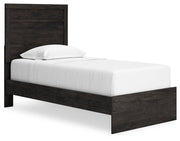 Ashley Furniture Belachime Bed with a sleek wooden frame and elegant headboard, shown from an angled side view.