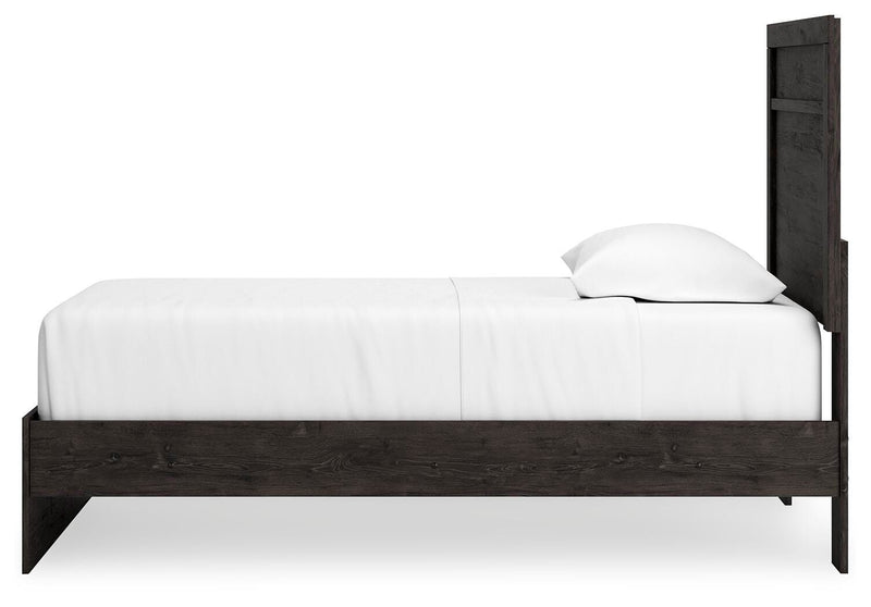 Ashley Furniture Belachime bedroom set featuring a bed with a headboard and matching side tables in a modern design.