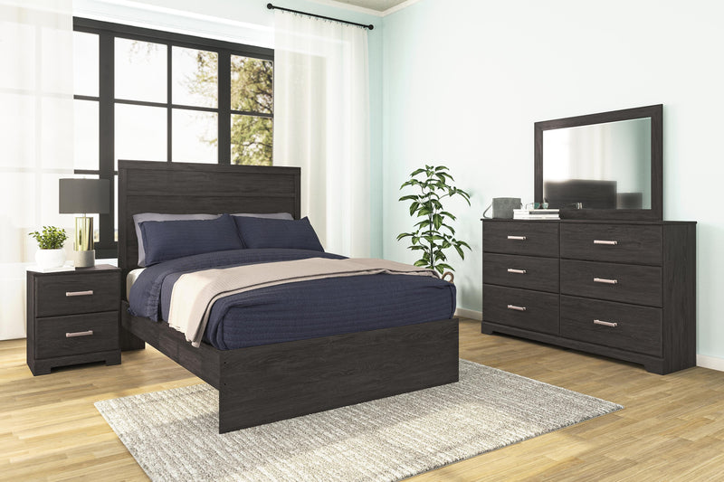 Ashley Furniture Belachime bedroom set featuring a wooden bed frame, matching nightstands, and coordinated bedroom furniture.