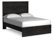 Ashley Furniture Belachime bedroom set with a bed, nightstands, and dresser, shown from an angled side view in a stylish bedroom.