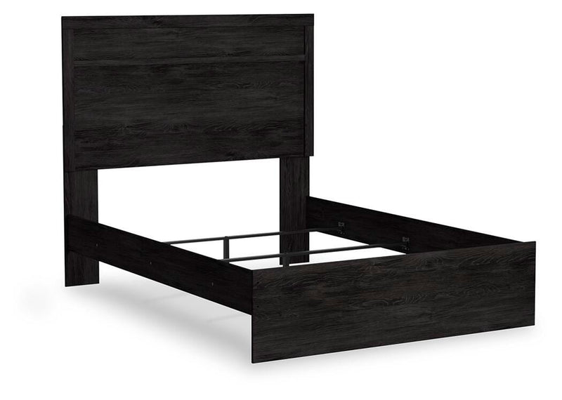 Ashley Furniture Belachime Bed with a wooden frame and stylish headboard, shown from an angled side view.