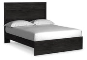 Ashley Furniture Belachime bedroom set with a sleek bed frame, matching nightstands, and bedding in a modern bedroom setting.