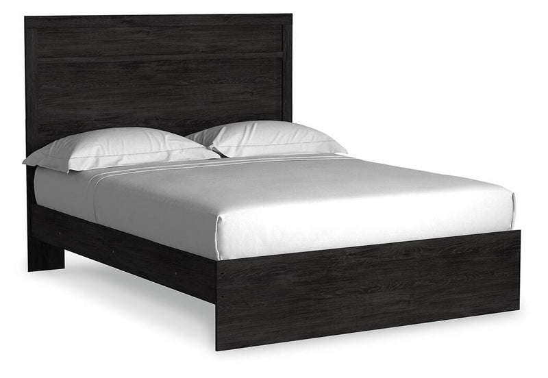 Ashley Furniture Belachime Bed with a wooden frame, showcasing a sleek, modern bed design in a bedroom setting.