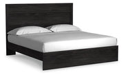 Ashley Furniture Belachime Bed in a stylish bedroom setting, showcasing the elegant headboard and matching frame.