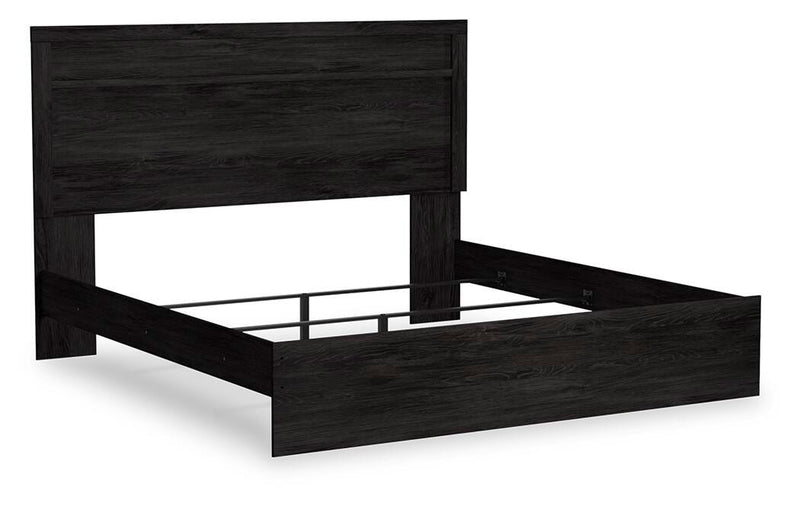 Ashley Furniture Belachime bed shown from an angled side view, featuring a stylish and sturdy bed frame in a modern design.