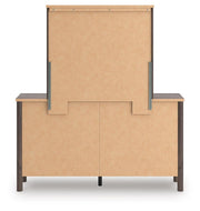 Ashley Furniture Pamytta dresser with mirror, featuring a modern wood finish and sleek design, shown from the back view.