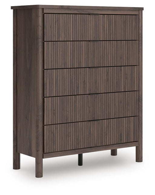Ashley Furniture Pamytta wide chest of drawers with sleek wood finish, angled design, and multiple storage drawers.